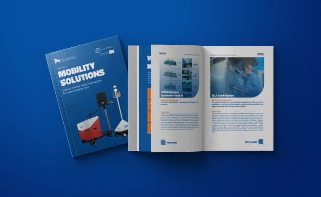 Blue mobility solutions brochures, one closed and one open showing photos and text pages.