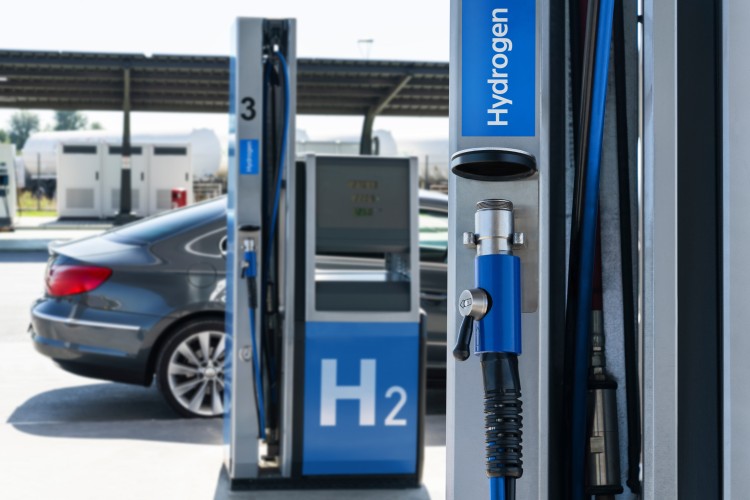 A hydrogen fueling station. Refueling car with hydrogen fuel