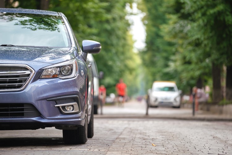 Car parked on a pedestrian road