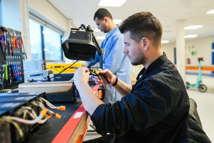 An expert in batteries working on-site