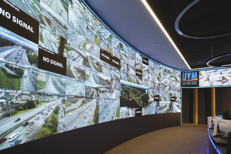 Wall of monitors displaying traffic monitoring software