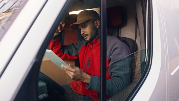 Courier using a tablet. 