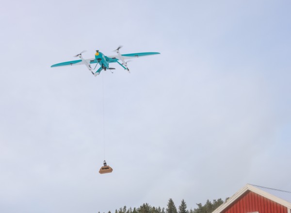 A drone carrying medicine in a snowy neigbourhood