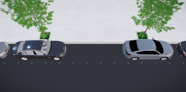 Aerial view of a city street with cars parked along the curb, lined with evenly spaced Popcurb sensors