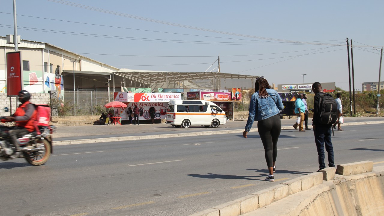 People crossing the road in Lusaka, Zambia. 