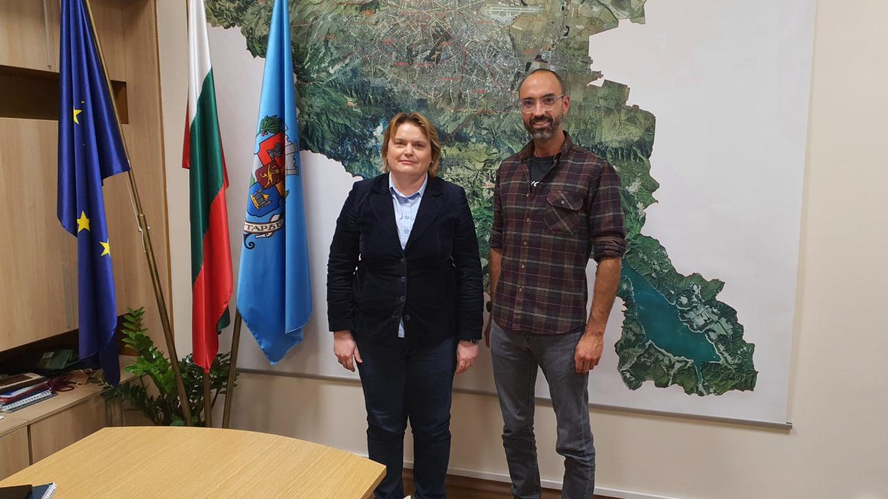 boardroom meeting with map in background