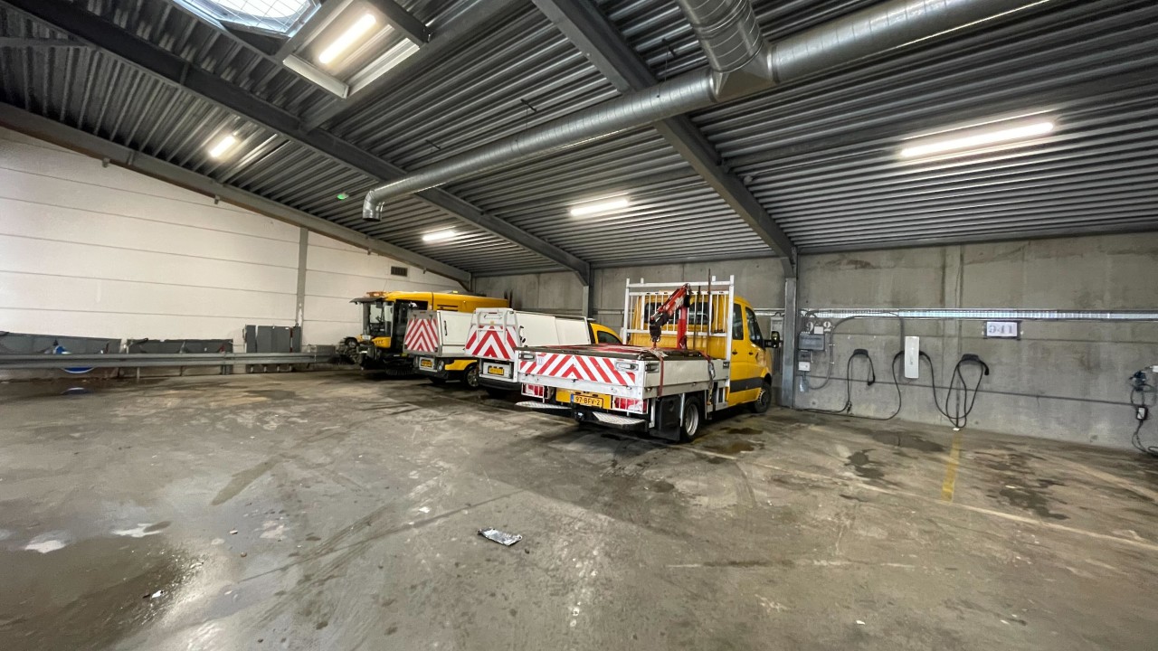 Parked municipal EV fleet vehicles in Venlo depot