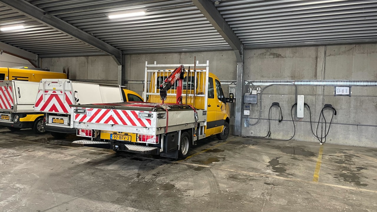 Parked municipal EV fleet vehicles in Venlo depot