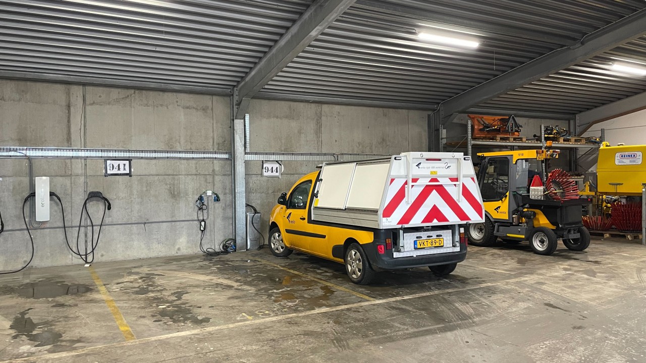 Parked municipal EV fleet vehicles in Venlo depot