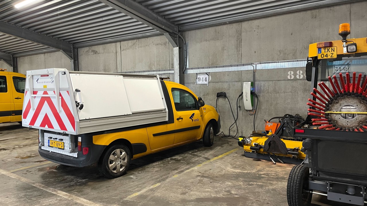 Parked municipal EV fleet vehicles in Venlo depot