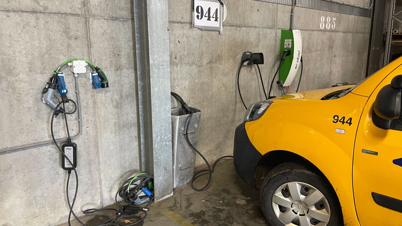 Parked municipal EV fleet vehicles in Venlo depot