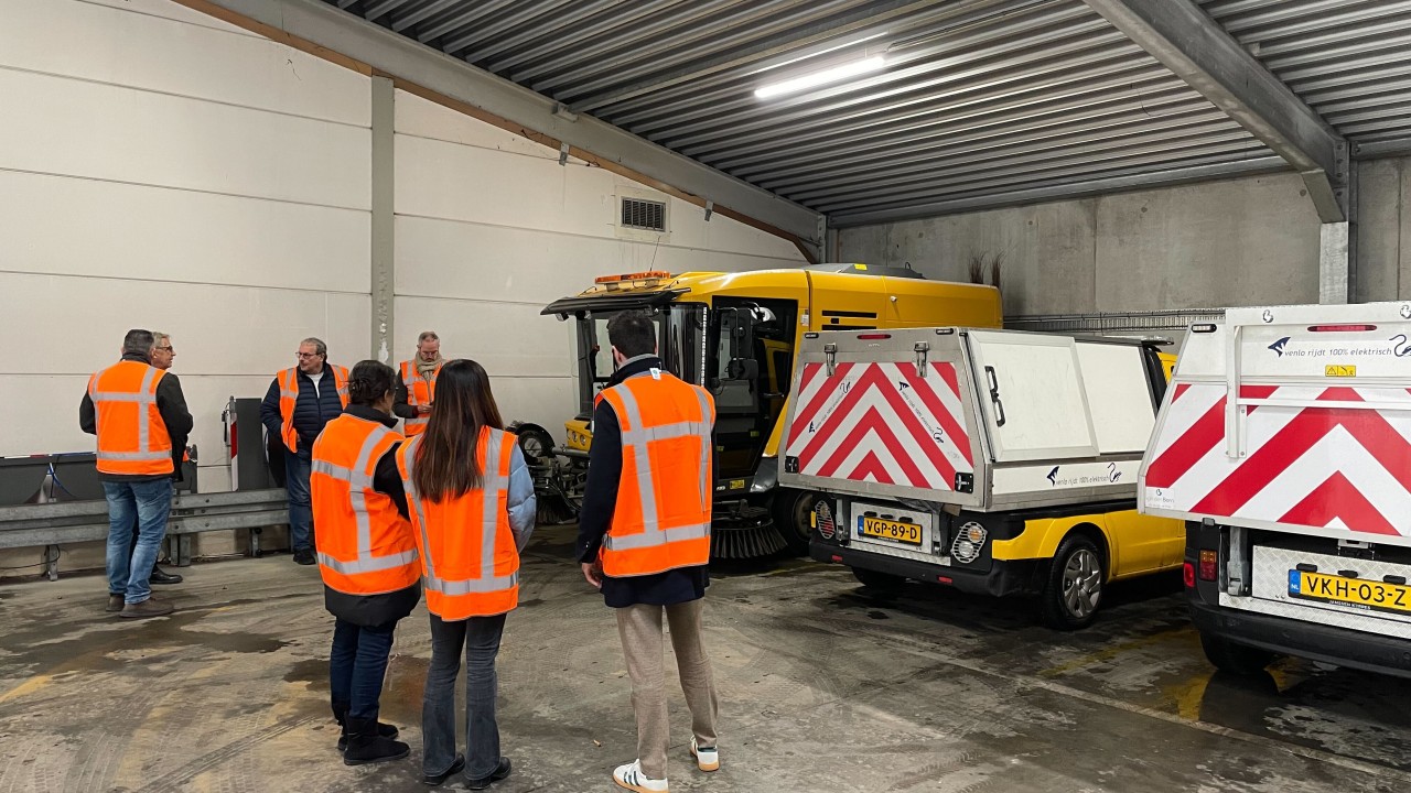 Parked municipal EV fleet vehicles in Venlo depot