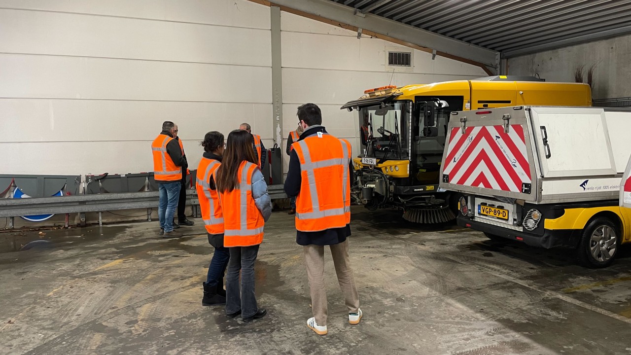 Parked municipal EV fleet vehicles in Venlo depot