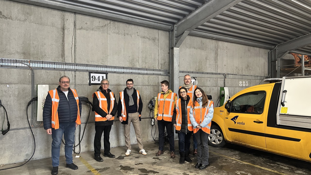 Parked municipal EV fleet vehicles in Venlo depot