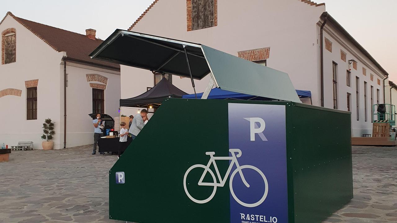 A smart and secure bike shelter, painted in green, placed inside the ancient fortress of Oradea, Romania