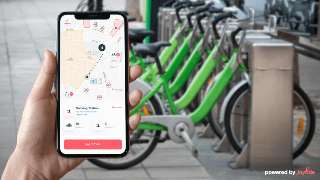 Joyride bike rental app in from of a bike station