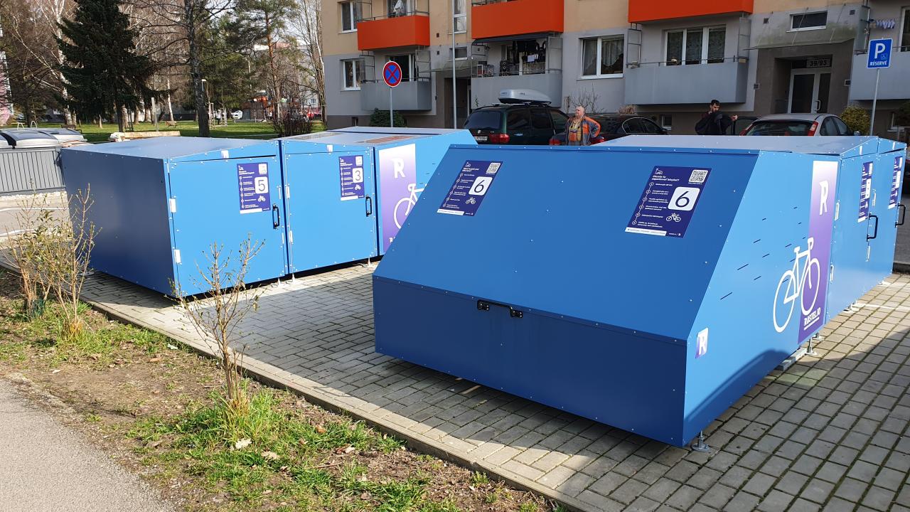 A multi-unit modular micromobility hub located in a residential area in Dubnica nad Vahom, Slovakia